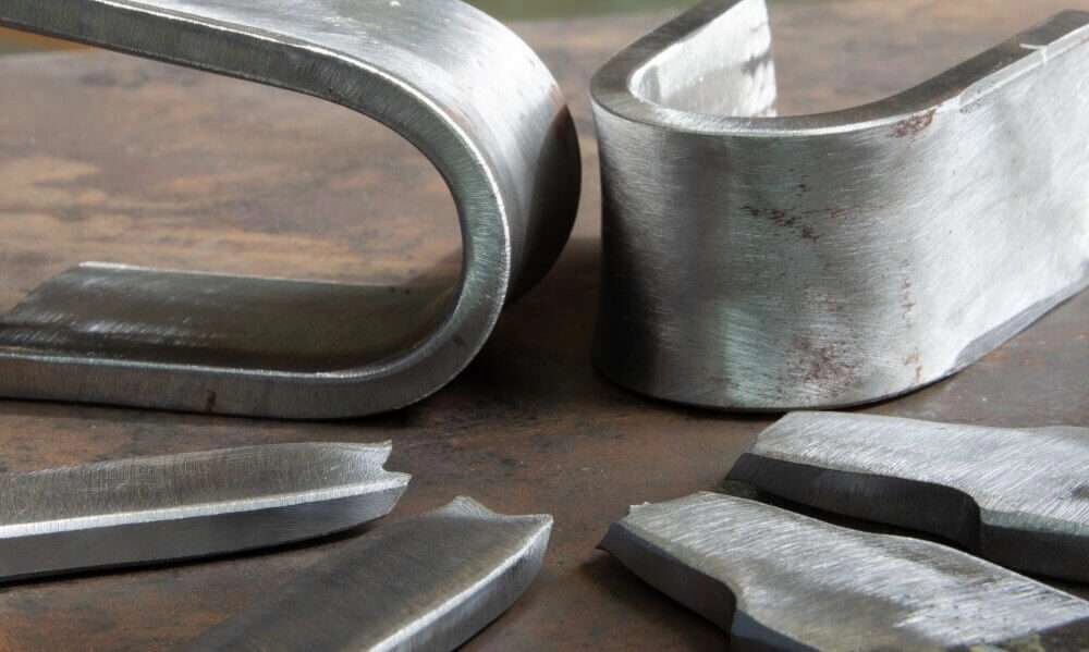 Steel and aluminum parts sized with a factor of safety against yield